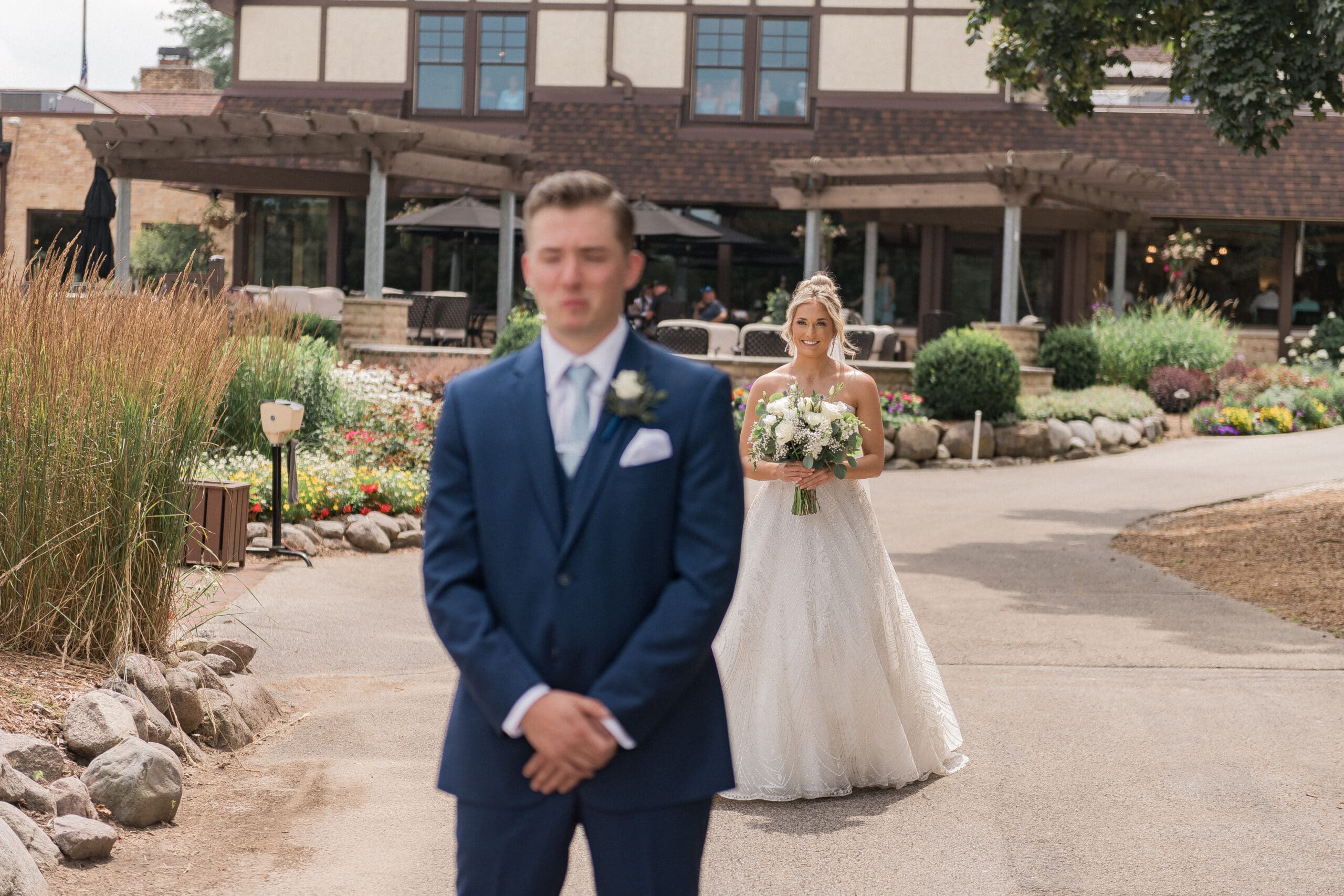 A modern bride and groom sharing an emotional First Look moment before their wedding ceremony, captured by BB Photo & Associates